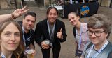 A group photo of Lu Wilson, Me, Shawn Anuptra Martin, Michelle Barker, Ryan Varley, some people have beers in hands