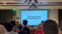 Julia Miocene speaking at css cafe with a slide behind her: But can you do anything useful?