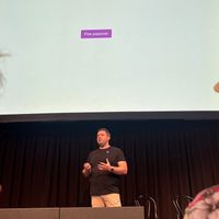 Me presenting, above me there is a screen with a button on it saying fire popover