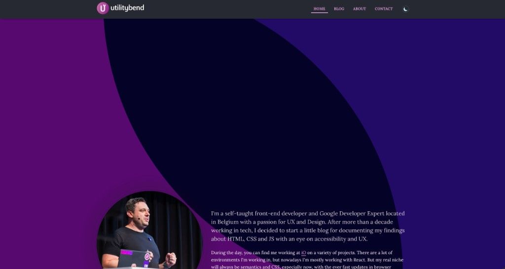 The old utilitybend about page in dark mode, showing the orb blobs behind the author's photo and bio
